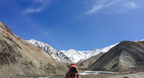 Man backpacker traveling hiking in mountains Travel Lifestyle success concept adventure active summer vacations outdoor mountaineering sport - Vintage effect style pictures.